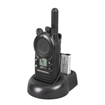Motorola CLS1413 two-way radio in charger with holster, three-quarter left view